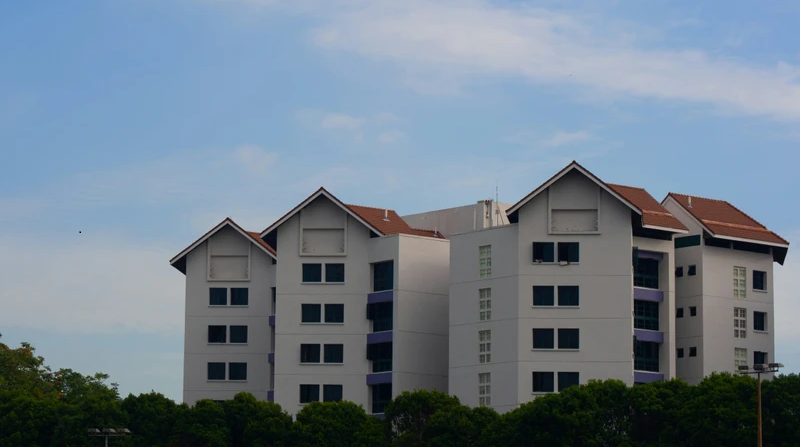 Modern residential apartments next to a body of water.